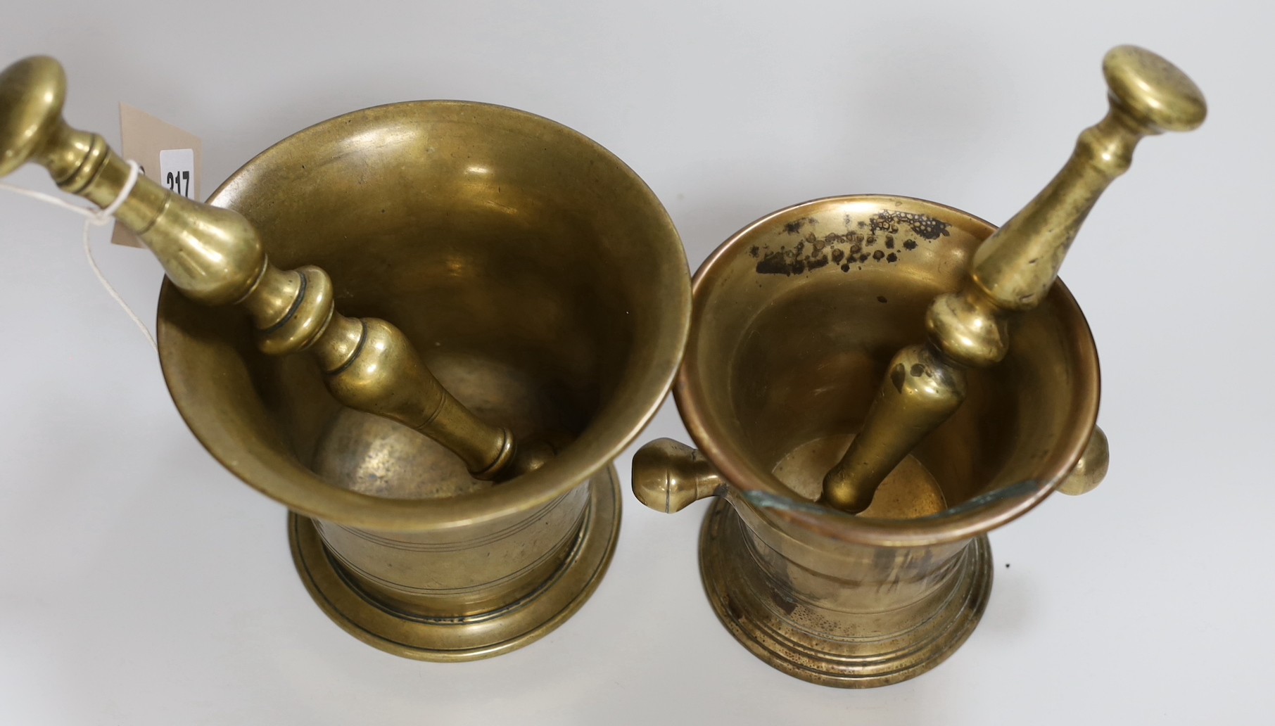Two 18th/19th century brass mortars, with pestles